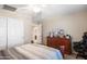 Bedroom featuring a queen size bed, plush carpet, and sliding closet doors at 16918 W Statler St, Surprise, AZ 85388
