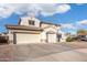 Home with a large driveway, a private gated entrance and a convenient three-car garage at 16918 W Statler St, Surprise, AZ 85388