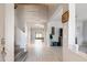 Spacious foyer with high ceilings, tile flooring, and staircase leading to upper level at 16918 W Statler St, Surprise, AZ 85388