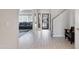 Bright foyer with tile flooring and staircase offers access to the living room at 16918 W Statler St, Surprise, AZ 85388