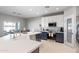 Bright kitchen features an island, white cabinets, subway tile backsplash, and stainless steel appliances at 16918 W Statler St, Surprise, AZ 85388