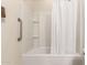 Clean white bathroom features a shower and grab bar at 17462 W Straight Arrow Ln, Surprise, AZ 85387
