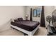 Bedroom features natural light and neutral decor with dark brown furniture at 17462 W Straight Arrow Ln, Surprise, AZ 85387