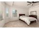 Bright bedroom with natural light from two windows and a ceiling fan at 17462 W Straight Arrow Ln, Surprise, AZ 85387
