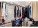 Walk-in closet full of various clothing items and boxes at 17462 W Straight Arrow Ln, Surprise, AZ 85387