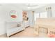 Charming bedroom featuring playful decor, a cozy crib, complemented by natural light from the window at 17473 N 167Th Dr, Surprise, AZ 85374
