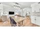 Stylish dining room with a modern light fixture and open to the living area at 17473 N 167Th Dr, Surprise, AZ 85374