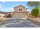 Charming two-story home with a large driveway and well-maintained front yard at 17473 N 167Th Dr, Surprise, AZ 85374