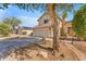 Well-maintained two-story home with a tile roof and spacious driveway leading to the garage at 17473 N 167Th Dr, Surprise, AZ 85374