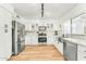 Bright kitchen featuring stainless steel appliances, white cabinetry and new fixtures at 17473 N 167Th Dr, Surprise, AZ 85374