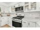 Well-equipped kitchen featuring updated appliances and elegant marble countertops at 17473 N 167Th Dr, Surprise, AZ 85374