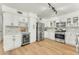 Modern kitchen with white cabinets, stainless steel appliances, and ample counter space at 17473 N 167Th Dr, Surprise, AZ 85374