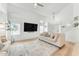 Inviting living room featuring a cozy seating area, natural light, and modern decor at 17473 N 167Th Dr, Surprise, AZ 85374