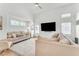 Bright living room with vaulted ceiling, plush sofas, and large screen tv at 17473 N 167Th Dr, Surprise, AZ 85374