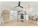 Bright office space with carpet flooring and a contemporary ceiling fan at 17473 N 167Th Dr, Surprise, AZ 85374