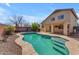Backyard featuring a sparkling swimming pool and a covered patio attached to the house at 17473 N 167Th Dr, Surprise, AZ 85374