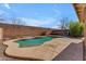 Backyard pool surrounded by concrete and rock landscaping, perfect for outdoor enjoyment at 17473 N 167Th Dr, Surprise, AZ 85374