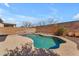 Inviting pool with stone border, surrounded by desert landscaping and a block wall at 17473 N 167Th Dr, Surprise, AZ 85374