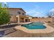 Spacious backyard with a kidney-shaped pool and covered patio, ideal for relaxation and entertaining at 17473 N 167Th Dr, Surprise, AZ 85374