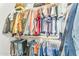 This walk-in closet provides plentiful hanging storage for a large wardrobe and folded garments at 17473 N 167Th Dr, Surprise, AZ 85374