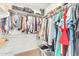 A well-organized walk-in closet with ample storage racks and shelves for clothing, handbags, and shoes at 17473 N 167Th Dr, Surprise, AZ 85374