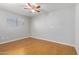 Clean, bright bedroom with wood-look floors and a ceiling fan at 18202 N Cave Creek Rd # 134, Phoenix, AZ 85032
