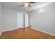 Clean, bright bedroom with wood-look floors and a ceiling fan at 18202 N Cave Creek Rd # 134, Phoenix, AZ 85032