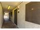 Building exterior shows unit door with security screen and stucco detail at 18202 N Cave Creek Rd # 134, Phoenix, AZ 85032