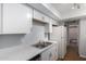 Updated kitchen features white cabinets, stainless sink and updated appliances at 18202 N Cave Creek Rd # 134, Phoenix, AZ 85032
