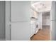 Well-lit kitchen with stainless steel sink, white cabinets, and updated appliances at 18202 N Cave Creek Rd # 134, Phoenix, AZ 85032