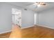 Bright open concept living room with wood-look floors connects to the kitchen at 18202 N Cave Creek Rd # 134, Phoenix, AZ 85032