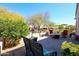 Lush backyard with desert landscaping, patio, and a cozy seating area at 19427 N 84Th Ave, Peoria, AZ 85382