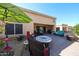 Outdoor patio with stylish furniture and a fire pit, ideal for gatherings at 19427 N 84Th Ave, Peoria, AZ 85382