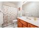 Cozy bathroom featuring a single sink vanity, toilet, and shower/tub combo at 19427 N 84Th Ave, Peoria, AZ 85382