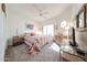 Bright bedroom with carpet, ceiling fan and natural light from the window at 19427 N 84Th Ave, Peoria, AZ 85382