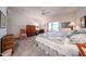Carpeted bedroom with ceiling fan, natural light, study space and neutral colors at 19427 N 84Th Ave, Peoria, AZ 85382