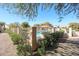 A community pool enclosed by a fence and lush greenery, offering a private and serene recreational space at 19427 N 84Th Ave, Peoria, AZ 85382