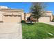 Charming single-story home with desert landscaping, paired garages, and a welcoming entrance at 19427 N 84Th Ave, Peoria, AZ 85382