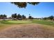 Expansive view of the lush golf course, showcasing the well-maintained green and surrounding landscaping at 19427 N 84Th Ave, Peoria, AZ 85382