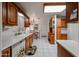 Charming kitchen showcasing wooden cabinets and open dining area at 19427 N 84Th Ave, Peoria, AZ 85382