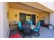 Covered patio featuring a dining table and chairs, perfect for enjoying meals outdoors at 19427 N 84Th Ave, Peoria, AZ 85382