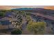 Expansive aerial view showcasing the community, surrounding desert landscape, and views of the mountains at 20044 N London Bridge Dr, Surprise, AZ 85387