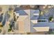 Aerial view of a home with a tile roof, desert landscaping, and a covered patio area at 20044 N London Bridge Dr, Surprise, AZ 85387