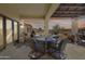 Inviting covered patio with comfortable seating and a built-in grill, perfect for outdoor entertaining at 20044 N London Bridge Dr, Surprise, AZ 85387
