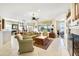 Open living room with comfortable seating and a fireplace, creating a warm and inviting atmosphere at 20044 N London Bridge Dr, Surprise, AZ 85387