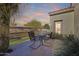 Charming outdoor patio with a seating area, ideal for enjoying the serene desert landscape at 20044 N London Bridge Dr, Surprise, AZ 85387
