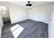 Large bedroom with luxury vinyl plank flooring, modern light fixture and easy access to the bathroom at 2018 W Western Dr, Chandler, AZ 85224