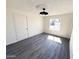 Bright bedroom with luxury vinyl plank flooring and modern light fixture at 2018 W Western Dr, Chandler, AZ 85224