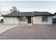 Charming single-story home featuring a well-maintained facade, gravel landscaping, and a driveway at 2018 W Western Dr, Chandler, AZ 85224