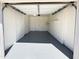 Bright and spacious garage featuring shelving, white walls, and epoxy flooring at 2018 W Western Dr, Chandler, AZ 85224